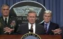 Defense Secretary Donald H. Rumsfeld, center, briefs the media at the Pentagon Tuesday, Sept. 11, 2001, in Washington, as Gen. Henry H. Shelton, chairman of the Joint Chiefs of Staff, left, and Sen John Warner, R-Va., watch. (AP Photo/Steve Helber)