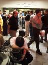 A tired passenger rests Wednesday, Sept. 12, 2001 at the Greyhound bus station in Chicago as others wait in long lines for tickets. With Chicago's two major airports shut down, people jammed bus stations, rental car counters and train stations seeking alternate means of travel. (AP Photo/Ted S. Warren)