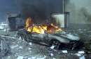 A car sits burning amid the rubble near the base of the destroyed World Trade Center in New York on September 11, 2001. In the worst terror attack on the U.S. mainland in modern history, two hijacked planes slammed into the twin towers of the World Trade Center in New York -- where about 40,000 people work -- and a third plane hit the Pentagon, across the Potomac river from Washington. The death toll, initially difficult to calculate, was expected to be in the thousands.   REUTERS/Peter Morgan